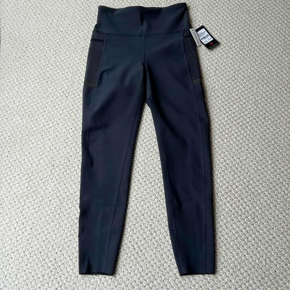 NWT Peloton Precise and charged reversible leggings size Small